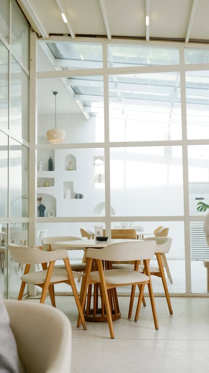Elegant modern living room with minimalist furniture and large windows